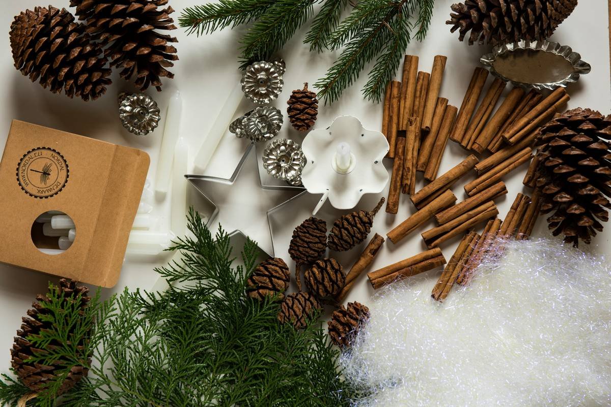Infographic showing pinecone decor reduces holiday waste by 60% compared to plastic ornaments, with icons for compostable, reusable, and low-cost attributes